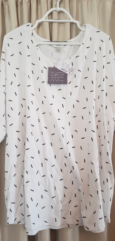 White shirt with gold and black rectangles.
